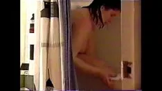 Play Peeping tom viewes co-ed shower down and trim her legs